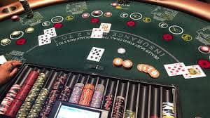 Live dealer studio showing professional broadcasters running outright betting coverage from HD tables with multiple monitors displaying league standings and tournament brackets